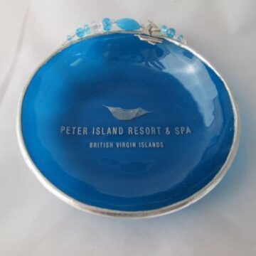 A blue plate with the name of peter island resort and spa on it.