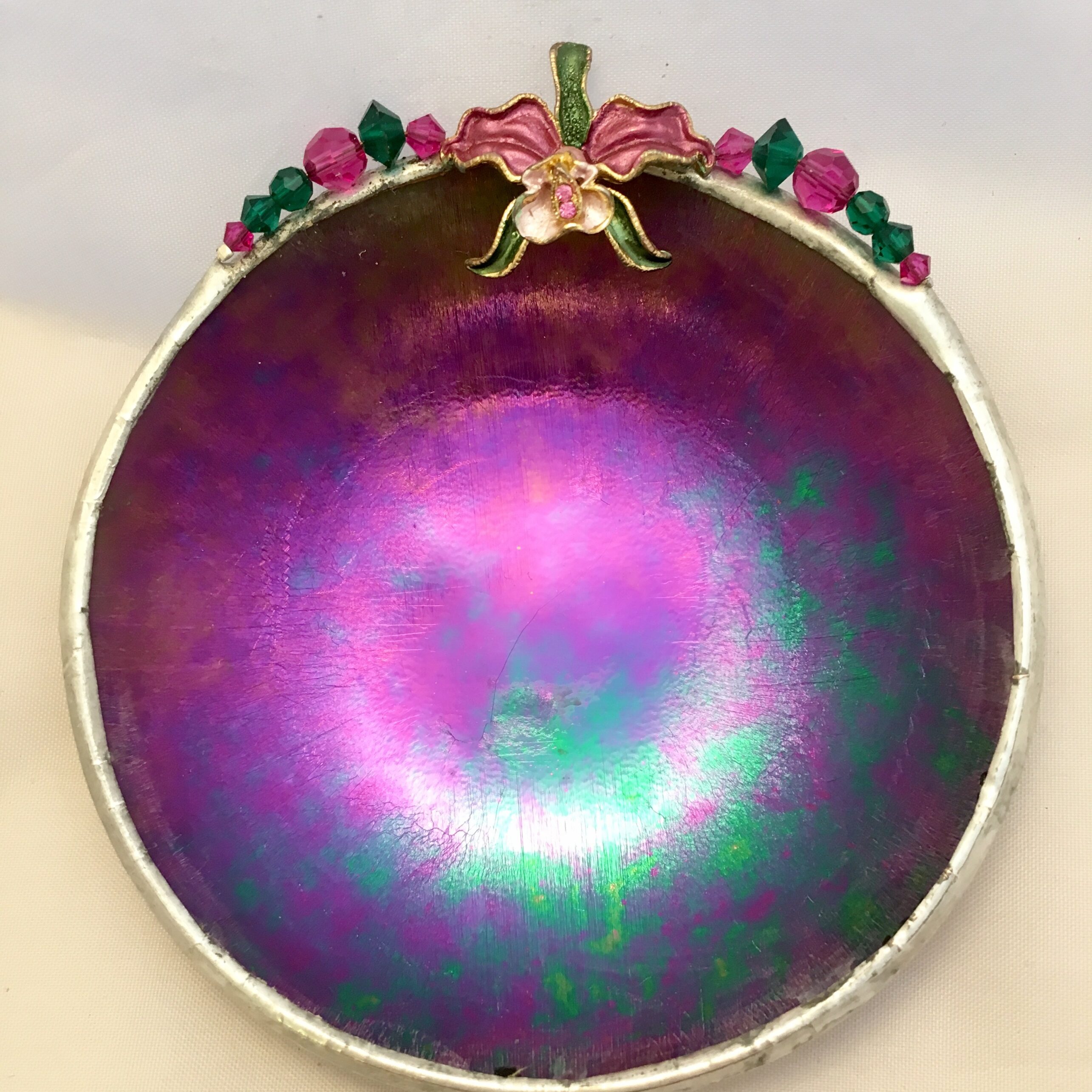 A purple bowl with a bow on top of it.