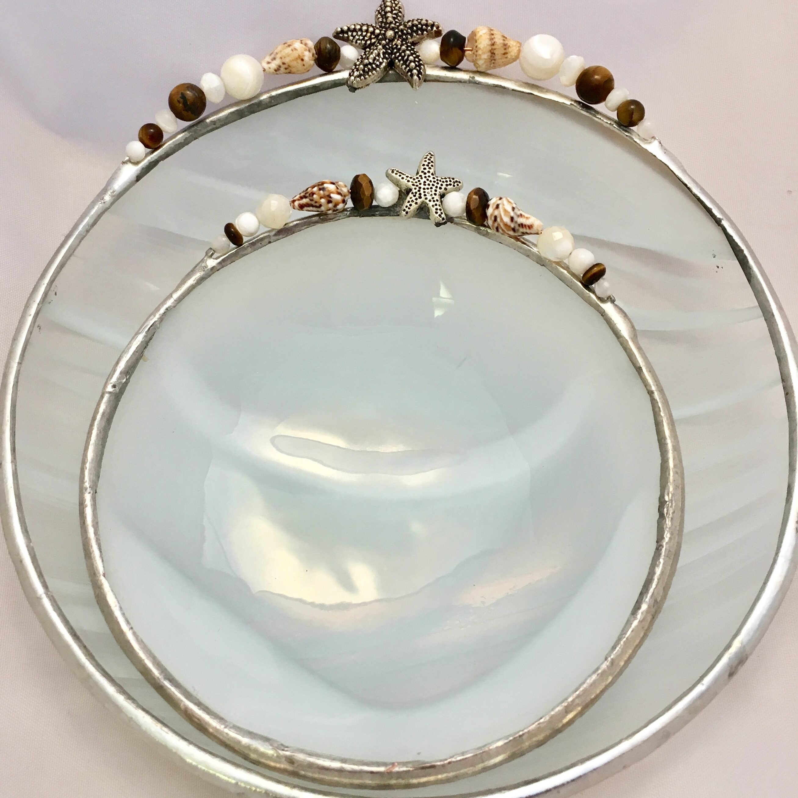 A glass plate with two plates on top of it.